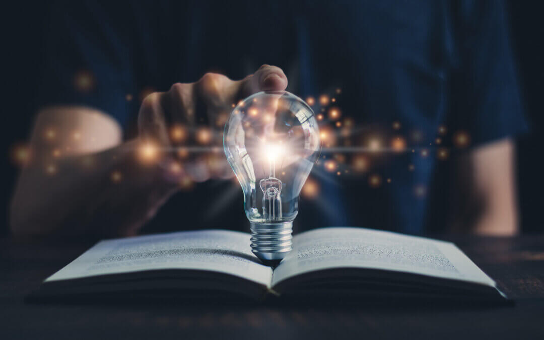 Glowing light bulb and book or text book with futuristic icon. Self learning or education knowledge and business studying concept. Idea of learning online class or e-learning at home.